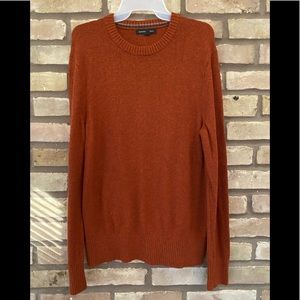 Burnt orange sweater.